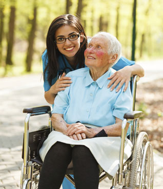Woman in Wheelchair and a Nurse